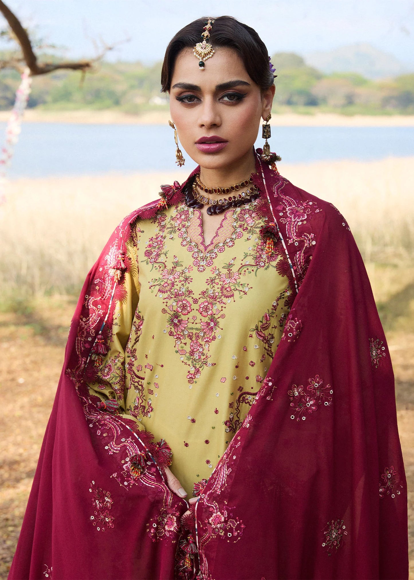 Model wearing Hussain Rehar Luxury Lawn '25 Minted in mustard with maroon embroidery. Shop Pakistani luxury pret online in the UK.