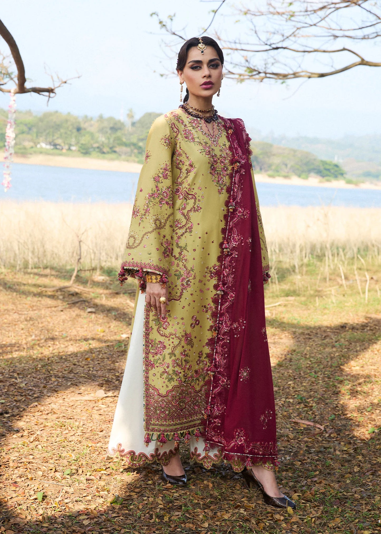 Model wearing Hussain Rehar Luxury Lawn '25 Minted in mustard with maroon embroidery. Shop Pakistani luxury pret online in the UK.