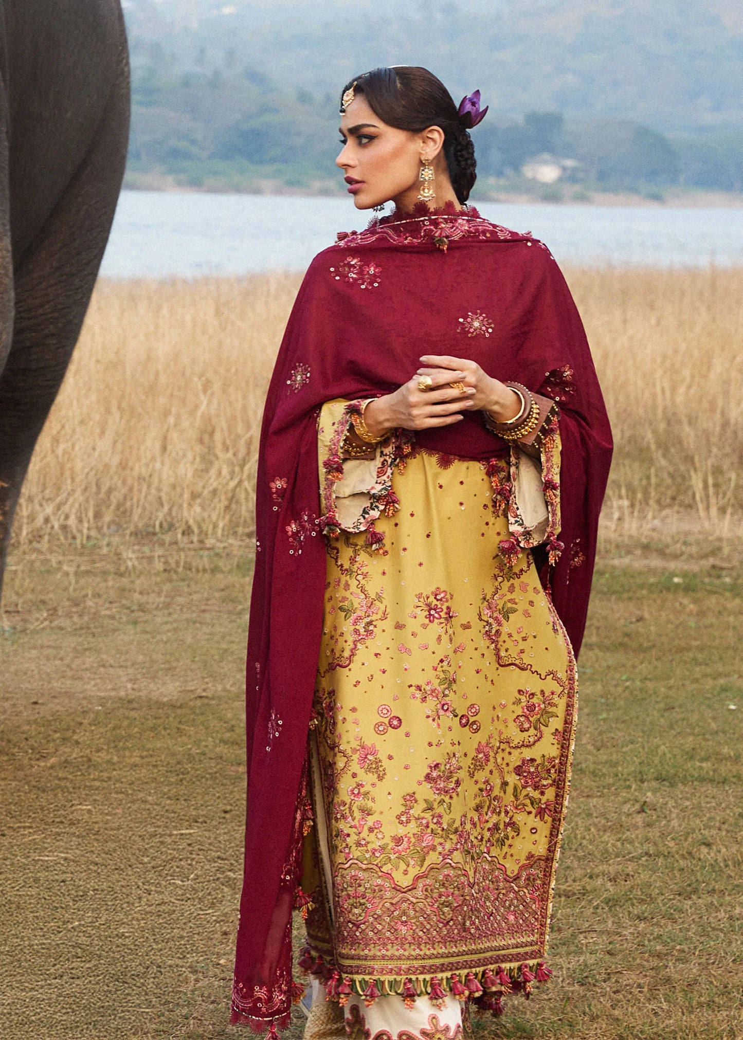 Model wearing Hussain Rehar Luxury Lawn '25 Minted in mustard with maroon embroidery. Shop Pakistani luxury pret online in the UK.