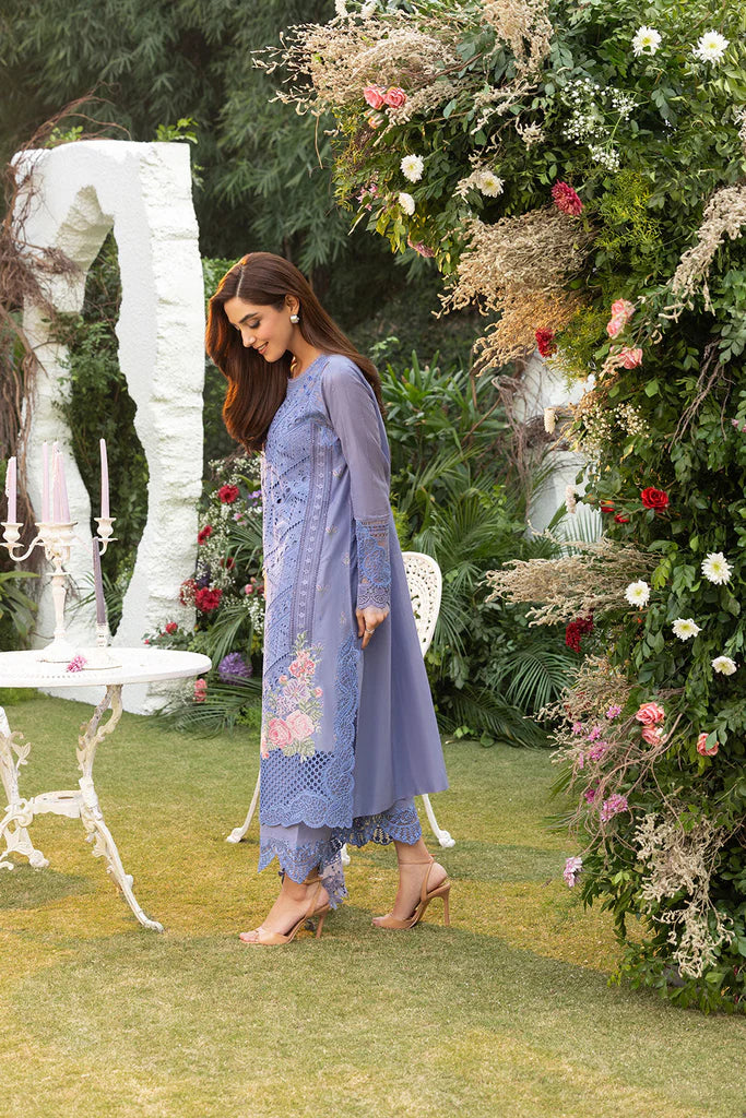 Model wearing Sobia Nazir Design 10B blue luxury lawn dress with intricate embroidery. Shop Pakistani clothes online in the UK for casual and festive wear.