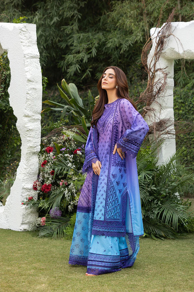 Model wearing Sobia Nazir Design 12B purple and blue luxury lawn dress. Shop Pakistani clothes online in the UK for summer casual and festive wear.