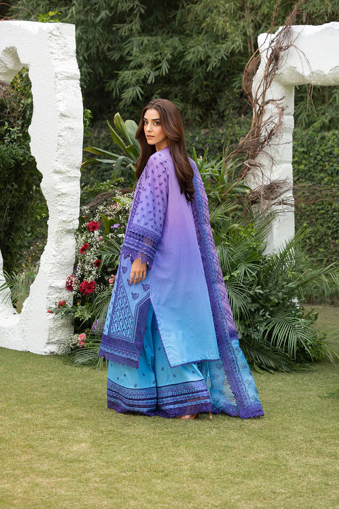 Model wearing Sobia Nazir Design 12B purple and blue luxury lawn dress. Shop Pakistani clothes online in the UK for summer casual and festive wear.