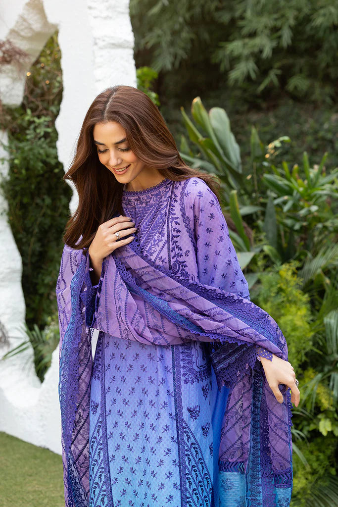 Model wearing Sobia Nazir Design 12B purple and blue luxury lawn dress. Shop Pakistani clothes online in the UK for summer casual and festive wear.