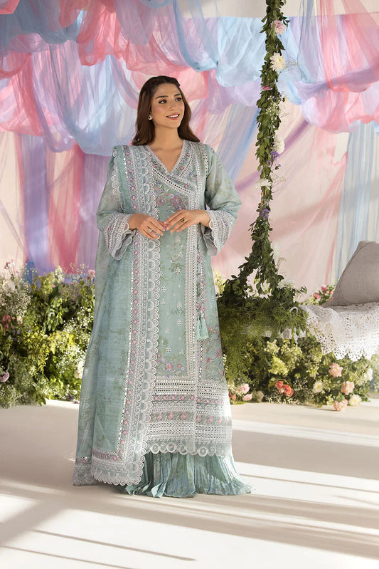 Model wearing Sobia Nazir Design 13A pastel green luxury lawn dress with delicate embroidery. Shop Pakistani clothes online in the UK for casual and festive wear.