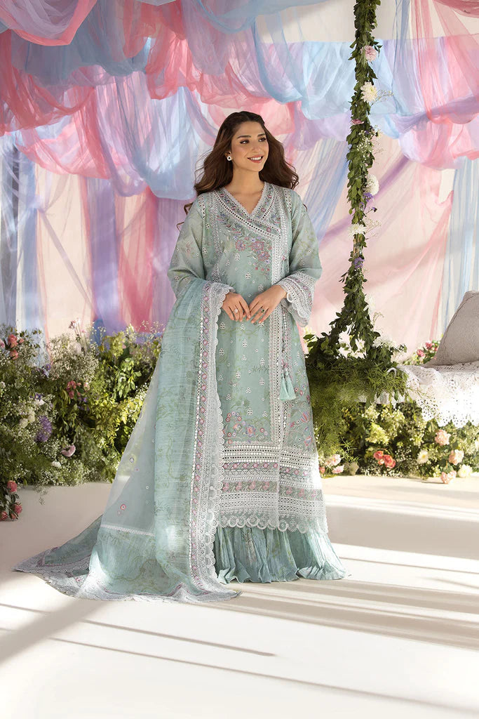 Model wearing Sobia Nazir Design 13A pastel green luxury lawn dress with delicate embroidery. Shop Pakistani clothes online in the UK for casual and festive wear.