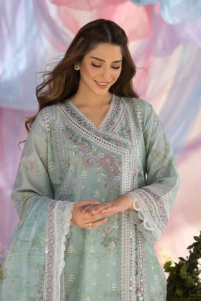 Model wearing Sobia Nazir Design 13A pastel green luxury lawn dress with delicate embroidery. Shop Pakistani clothes online in the UK for casual and festive wear.