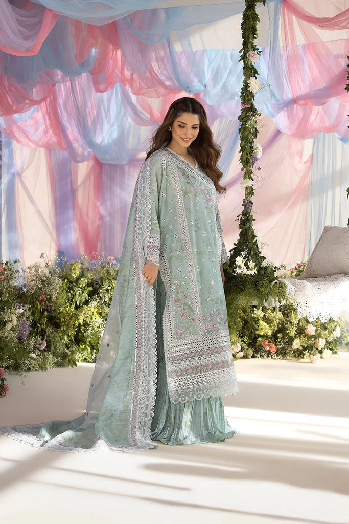 Model wearing Sobia Nazir Design 13A pastel green luxury lawn dress with delicate embroidery. Shop Pakistani clothes online in the UK for casual and festive wear.