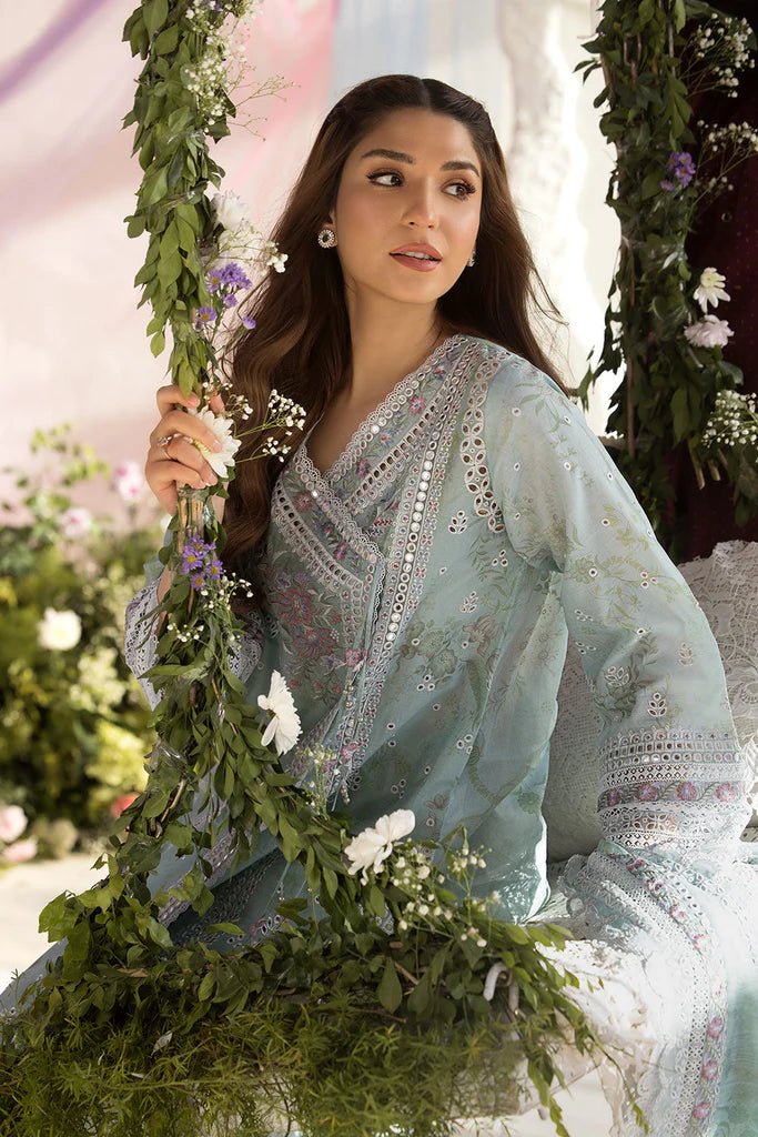 Model wearing Sobia Nazir Design 13A pastel green luxury lawn dress with delicate embroidery. Shop Pakistani clothes online in the UK for casual and festive wear.