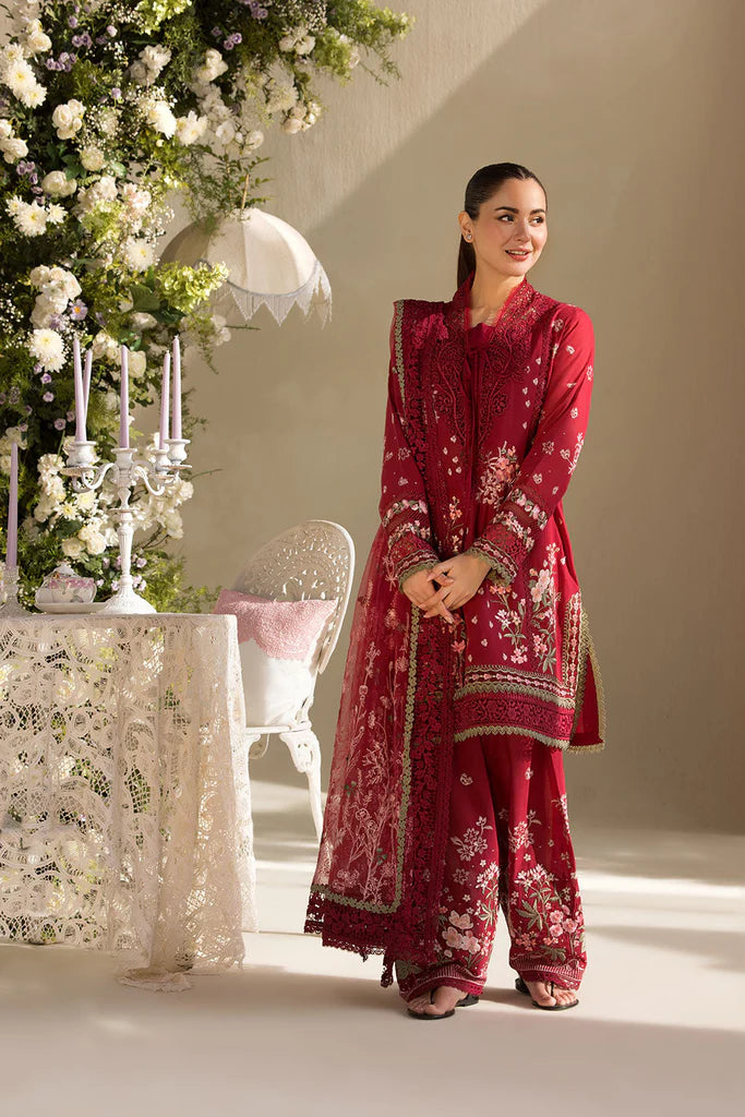 Model wearing Sobia Nazir Design 14A deep red luxury lawn dress with floral embroidery. Shop Pakistani clothes online in the UK for casual and festive wear.