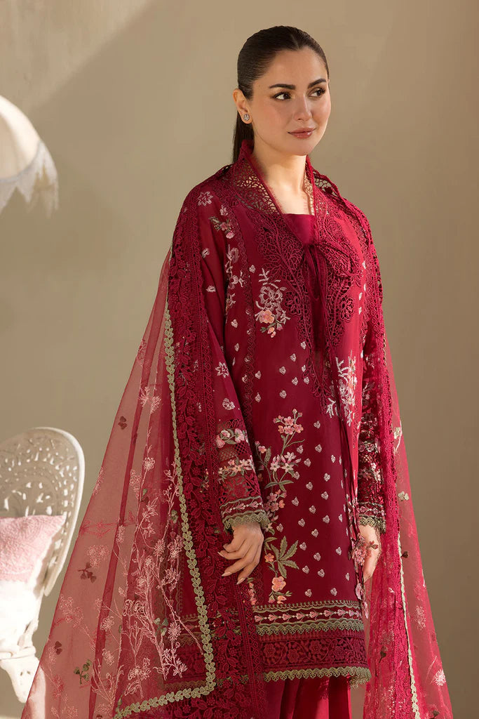 Model wearing Sobia Nazir Design 14A deep red luxury lawn dress with floral embroidery. Shop Pakistani clothes online in the UK for casual and festive wear.