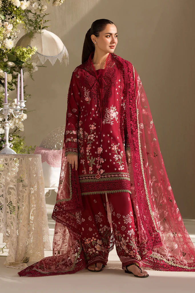 Model wearing Sobia Nazir Design 14A deep red luxury lawn dress with floral embroidery. Shop Pakistani clothes online in the UK for casual and festive wear.