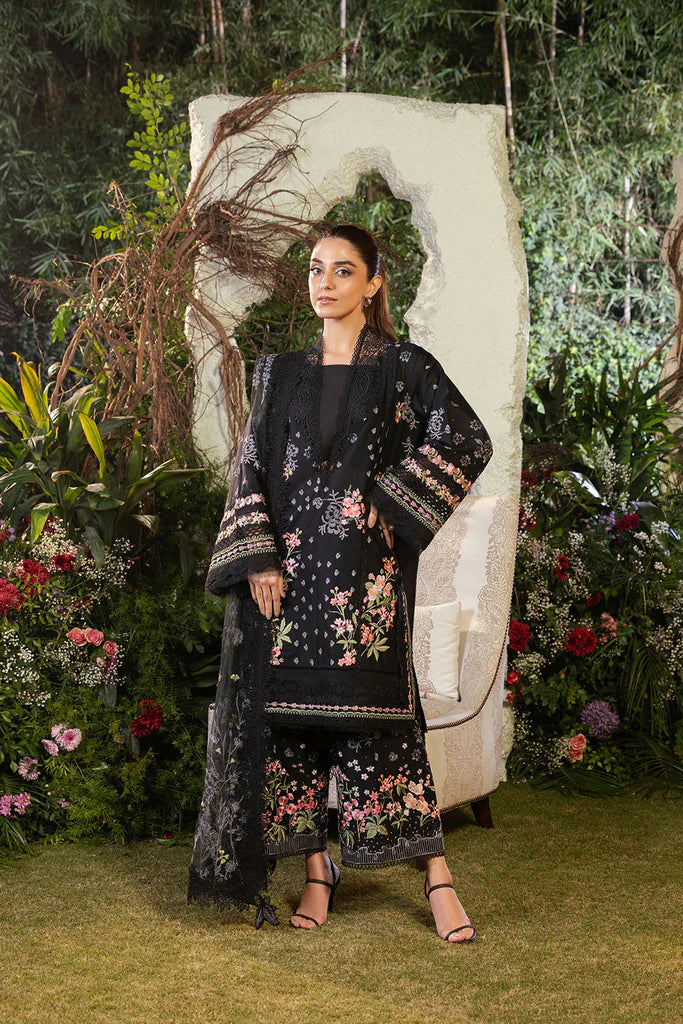 Model wearing Sobia Nazir Design 14B black luxury lawn dress with floral embroidery. Shop Pakistani clothes online in the UK for casual and festive wear.
