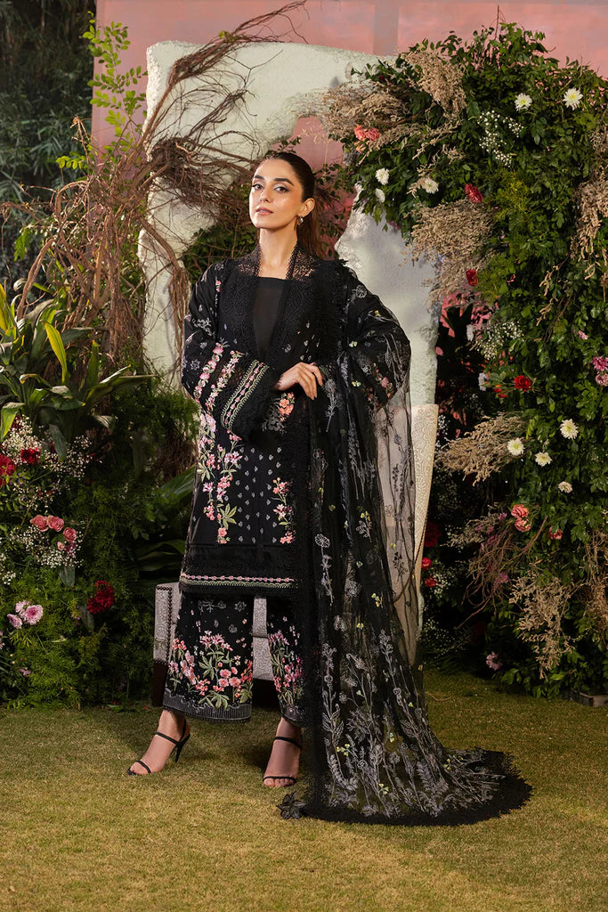 Model wearing Sobia Nazir Design 14B black luxury lawn dress with floral embroidery. Shop Pakistani clothes online in the UK for casual and festive wear.
