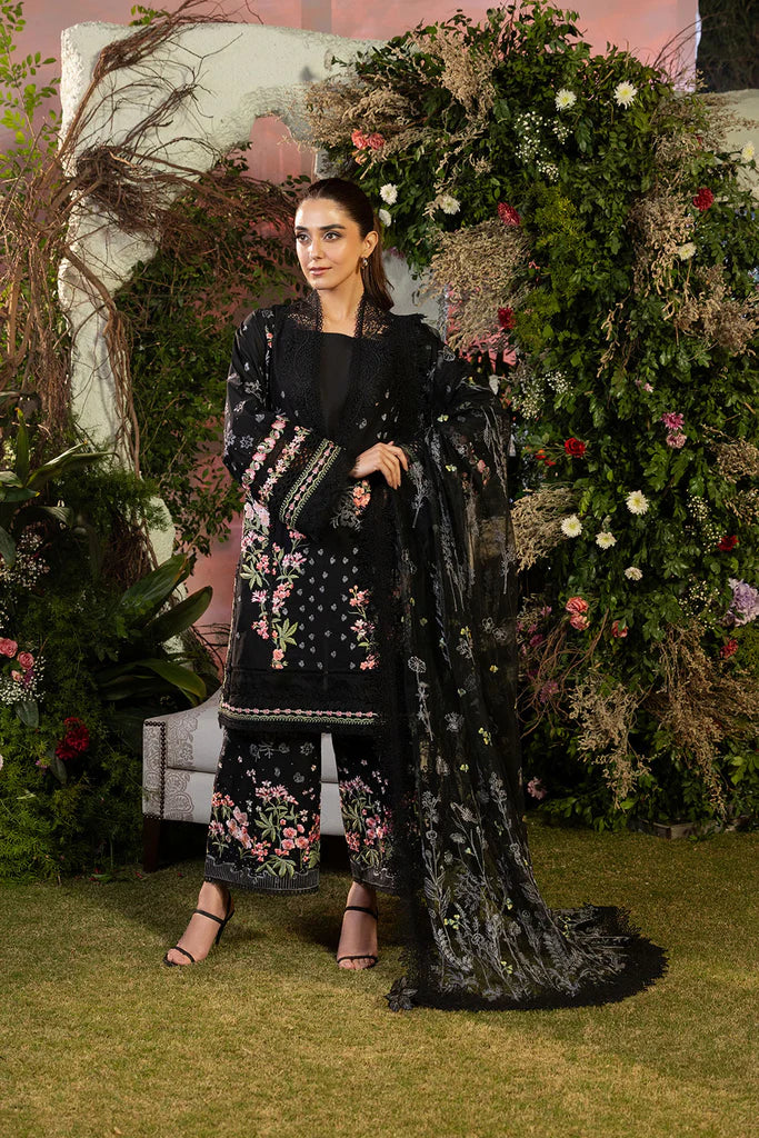 Model wearing Sobia Nazir Design 14B black luxury lawn dress with floral embroidery. Shop Pakistani clothes online in the UK for casual and festive wear.
