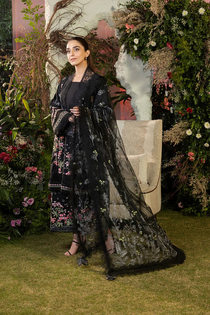 Model wearing Sobia Nazir Design 14B black luxury lawn dress with floral embroidery. Shop Pakistani clothes online in the UK for casual and festive wear.
