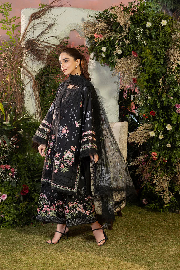 Model wearing Sobia Nazir Design 14B black luxury lawn dress with floral embroidery. Shop Pakistani clothes online in the UK for casual and festive wear.
