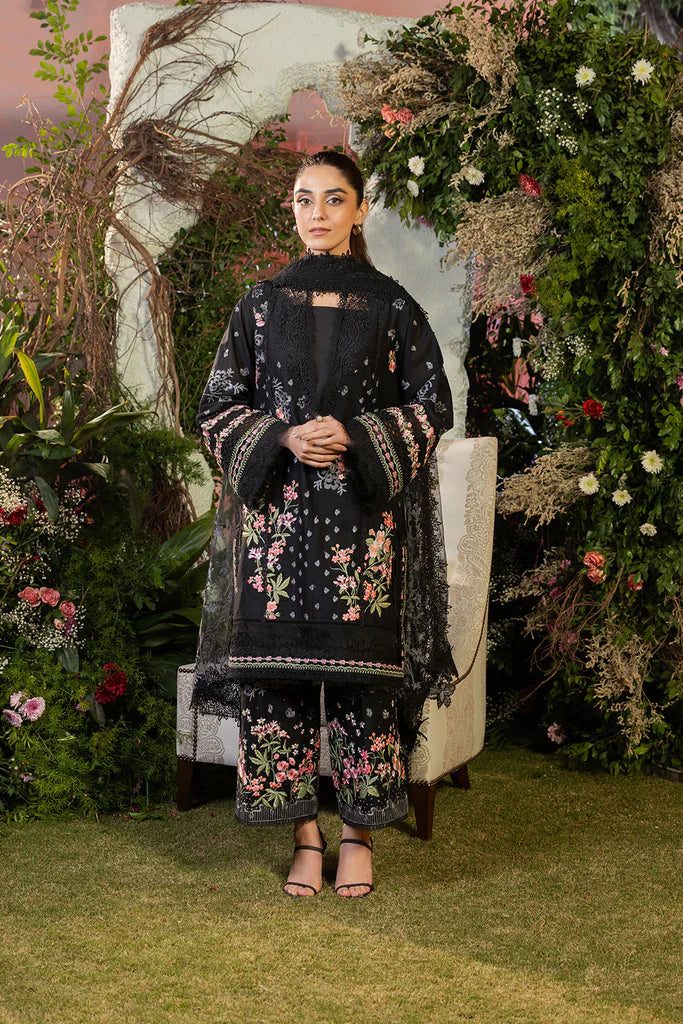 Model wearing Sobia Nazir Design 14B black luxury lawn dress with floral embroidery. Shop Pakistani clothes online in the UK for casual and festive wear.
