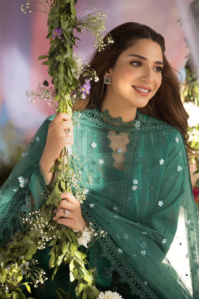 Model wearing Sobia Nazir Design 15B green luxury lawn dress with delicate embroidery. Shop Pakistani clothes online in the UK for casual and festive wear.