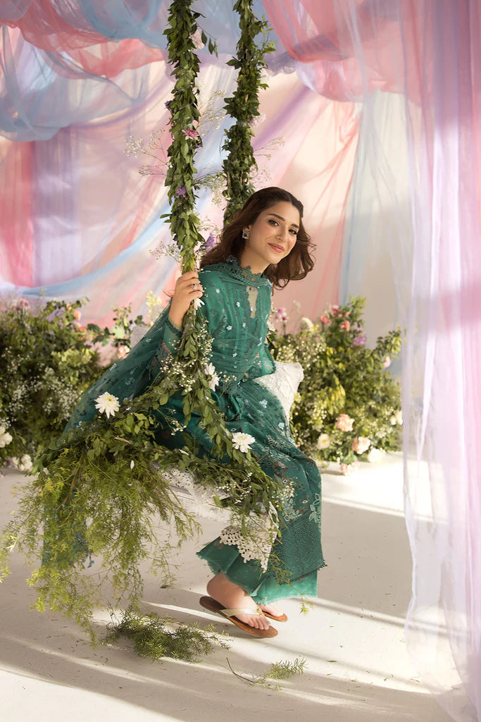 Model wearing Sobia Nazir Design 15B green luxury lawn dress with delicate embroidery. Shop Pakistani clothes online in the UK for casual and festive wear.