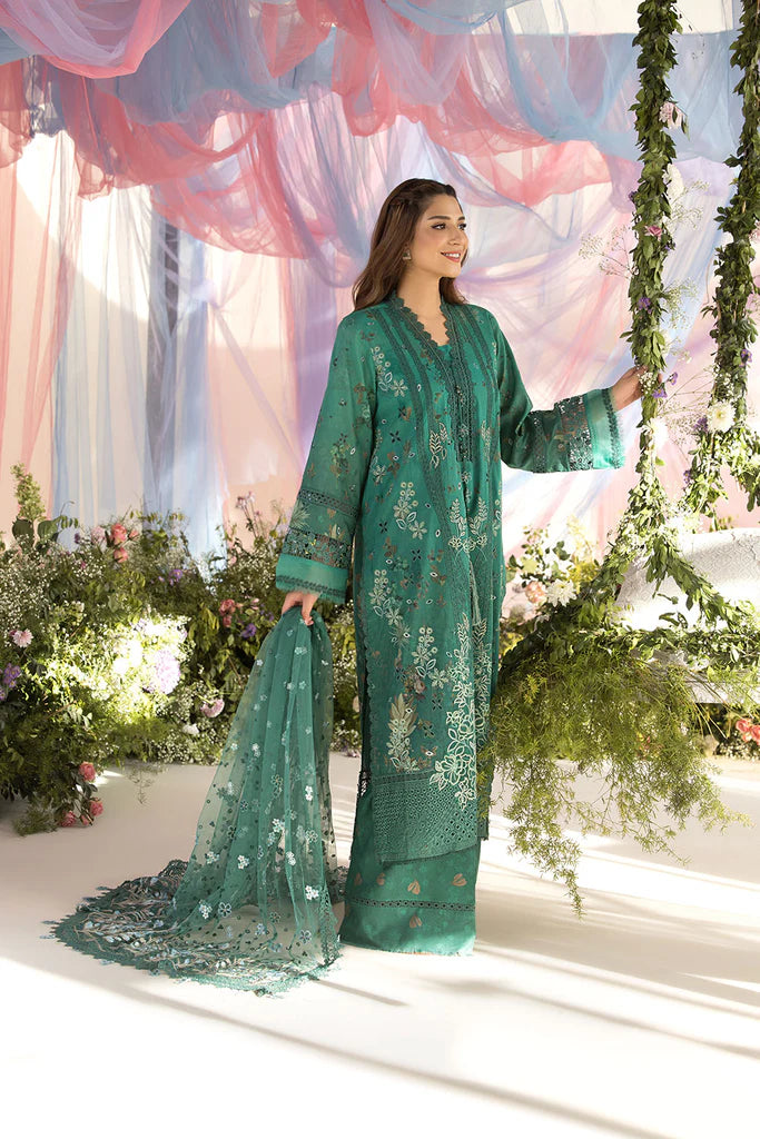 Model wearing Sobia Nazir Design 15B green luxury lawn dress with delicate embroidery. Shop Pakistani clothes online in the UK for casual and festive wear.