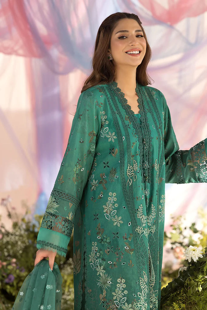 Model wearing Sobia Nazir Design 15B green luxury lawn dress with delicate embroidery. Shop Pakistani clothes online in the UK for casual and festive wear.