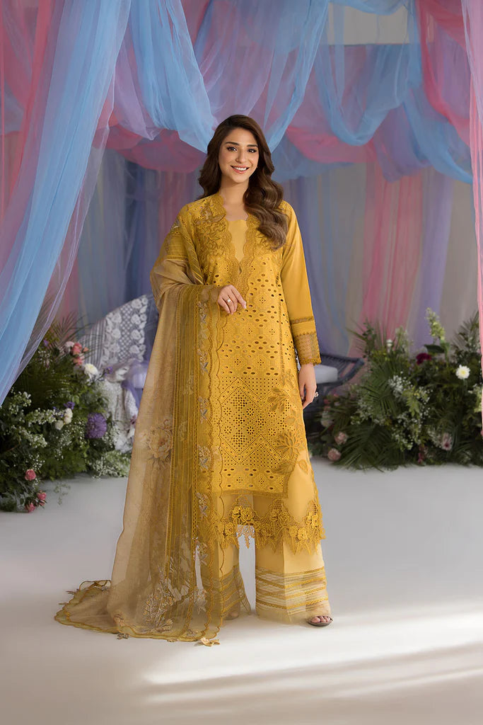 Model wearing Sobia Nazir Design 1A mustard yellow luxury lawn dress with intricate embroidery. Shop Pakistani clothes online in the UK for casual and festive wear.