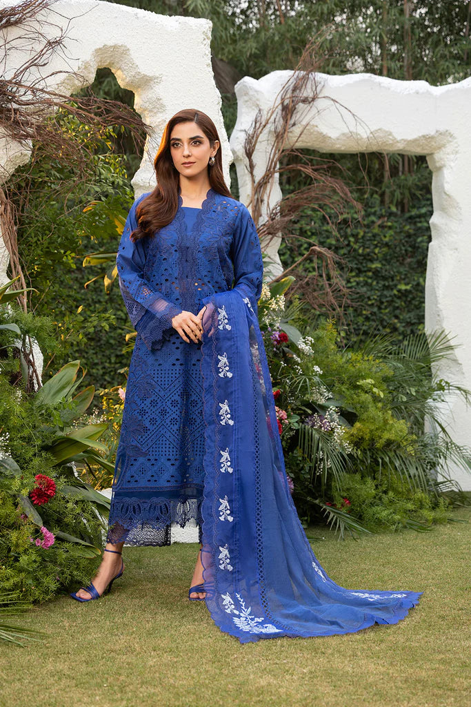 Model wearing Sobia Nazir Design 1B navy blue luxury lawn dress. Shop Pakistani clothes online in the UK for summer casual and festive wear.