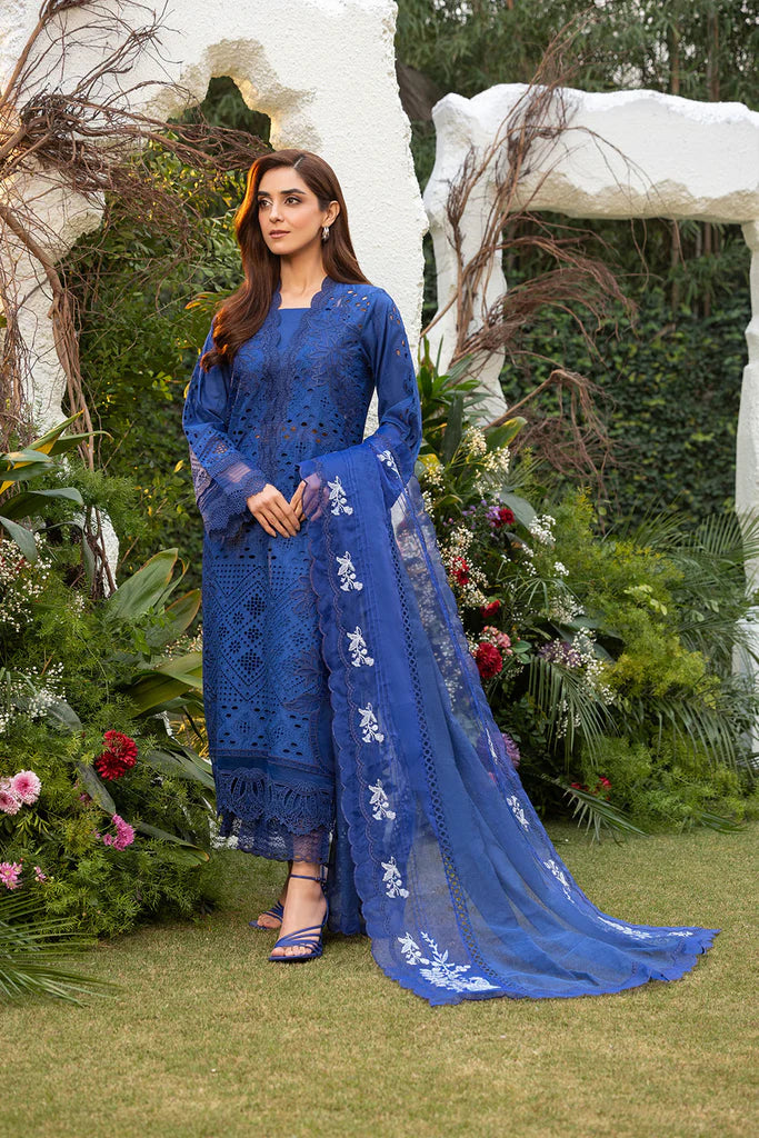 Model wearing Sobia Nazir Design 1B navy blue luxury lawn dress. Shop Pakistani clothes online in the UK for summer casual and festive wear.