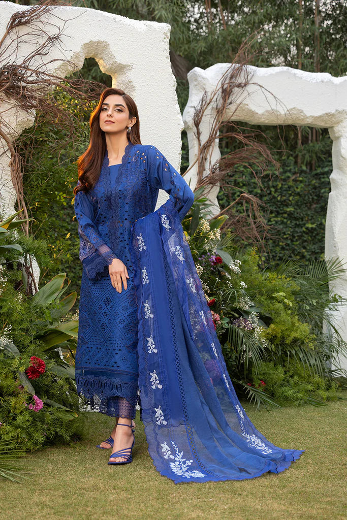 Model wearing Sobia Nazir Design 1B navy blue luxury lawn dress. Shop Pakistani clothes online in the UK for summer casual and festive wear.