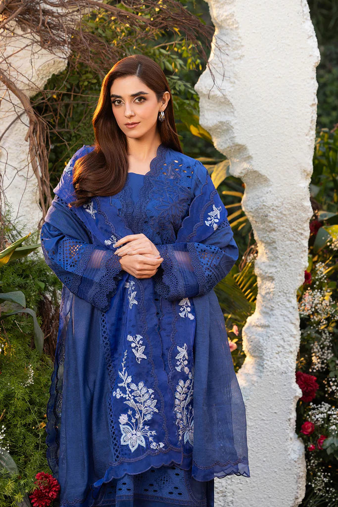 Model wearing Sobia Nazir Design 1B navy blue luxury lawn dress. Shop Pakistani clothes online in the UK for summer casual and festive wear.