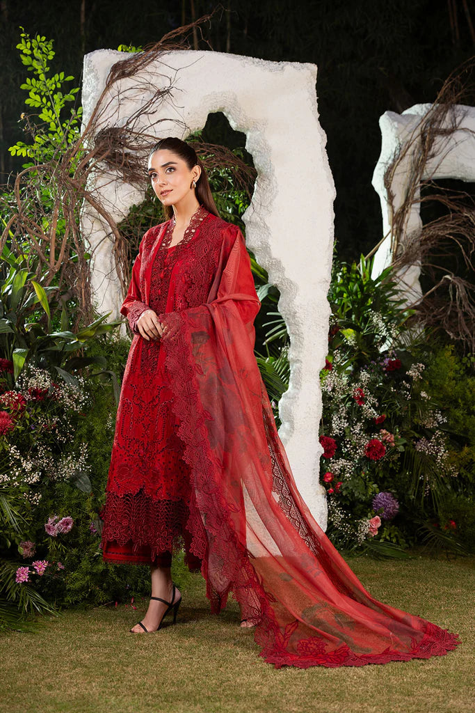 Model wearing Sobia Nazir Design 3A deep red luxury lawn dress with intricate embroidery. Shop Pakistani clothes online in the UK for casual and festive wear.