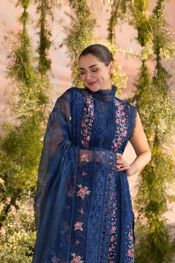 Model wearing Sobia Nazir Design 4A navy blue luxury lawn dress with floral embroidery. Shop Pakistani clothes online in the UK for casual and festive wear.