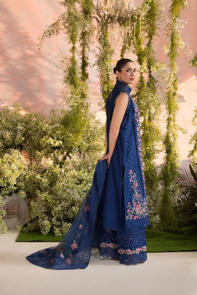 Model wearing Sobia Nazir Design 4A navy blue luxury lawn dress with floral embroidery. Shop Pakistani clothes online in the UK for casual and festive wear.