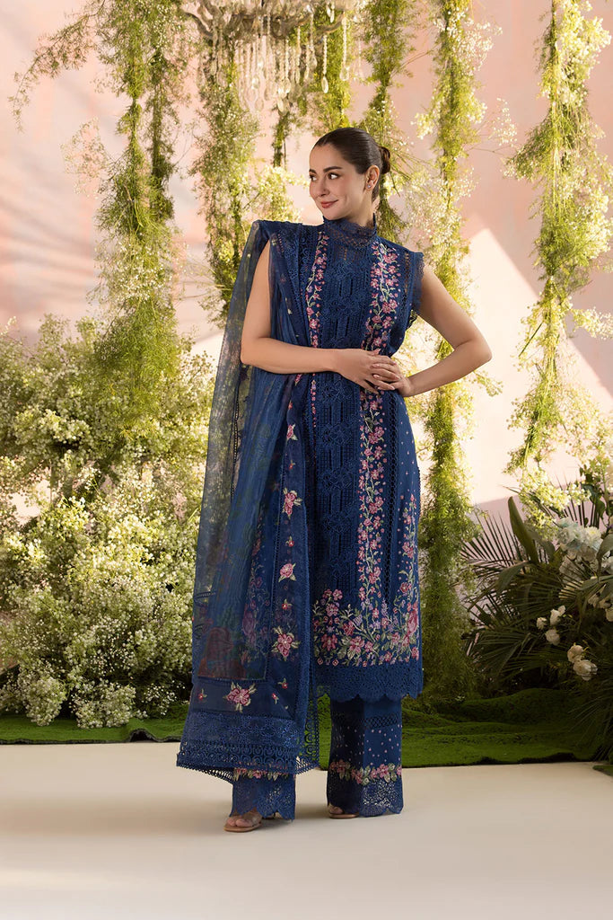 Model wearing Sobia Nazir Design 4A navy blue luxury lawn dress with floral embroidery. Shop Pakistani clothes online in the UK for casual and festive wear.