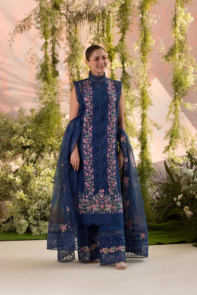 Model wearing Sobia Nazir Design 4A navy blue luxury lawn dress with floral embroidery. Shop Pakistani clothes online in the UK for casual and festive wear.