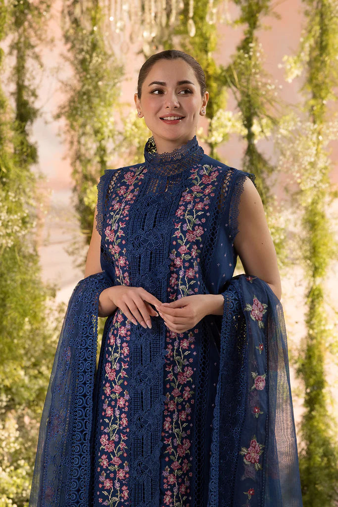 Model wearing Sobia Nazir Design 4A navy blue luxury lawn dress with floral embroidery. Shop Pakistani clothes online in the UK for casual and festive wear.