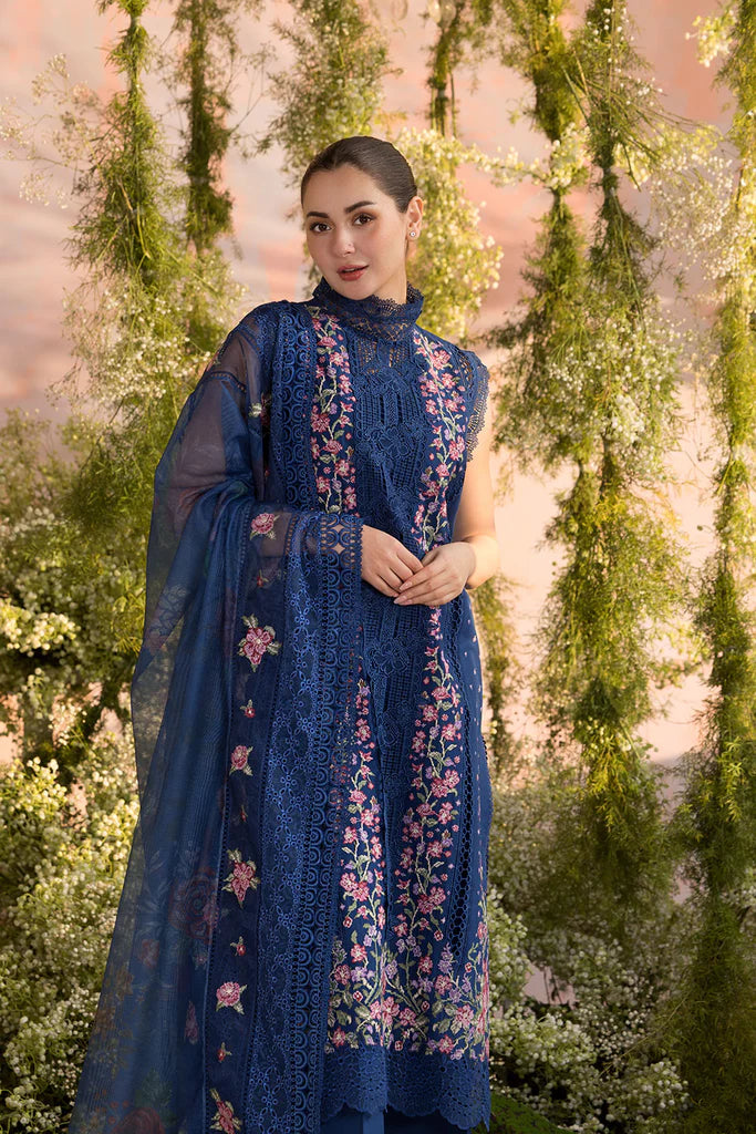 Model wearing Sobia Nazir Design 4A navy blue luxury lawn dress with floral embroidery. Shop Pakistani clothes online in the UK for casual and festive wear.