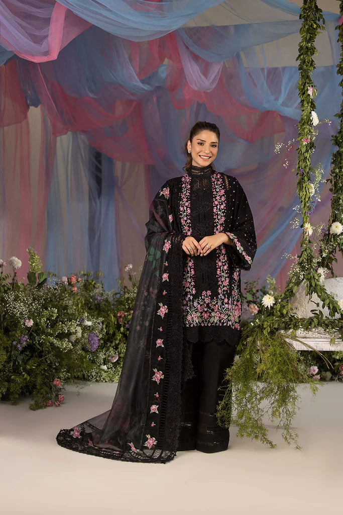 Model wearing Sobia Nazir Design 4B black luxury lawn dress with floral embroidery. Shop Pakistani clothes online in the UK for casual and festive wear.