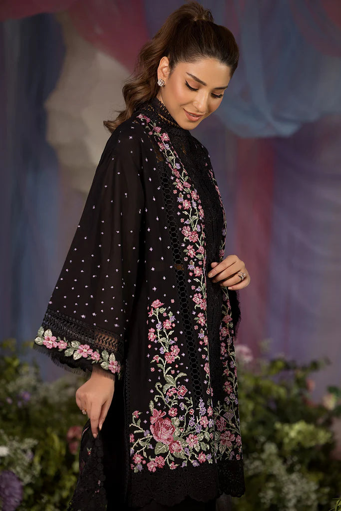 Model wearing Sobia Nazir Design 4B black luxury lawn dress with floral embroidery. Shop Pakistani clothes online in the UK for casual and festive wear.