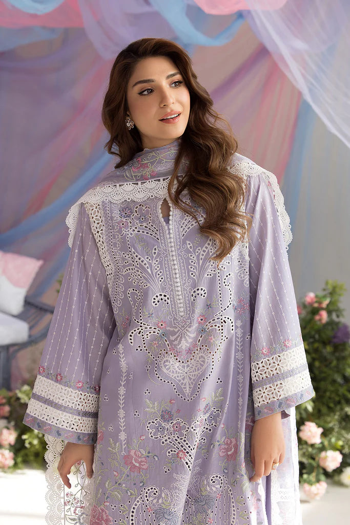 Model wearing Sobia Nazir Design 5A lilac luxury lawn dress with intricate embroidery. Shop Pakistani clothes online in the UK for casual and festive wear.
