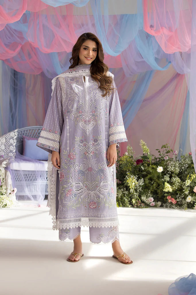 Model wearing Sobia Nazir Design 5A lilac luxury lawn dress with intricate embroidery. Shop Pakistani clothes online in the UK for casual and festive wear.
