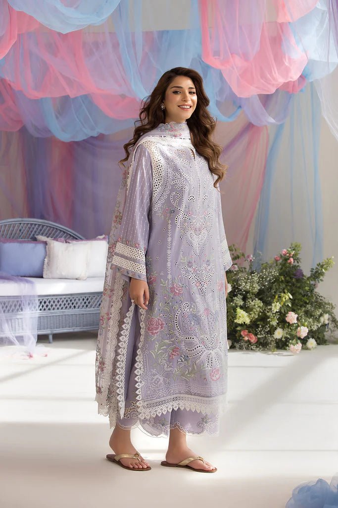 Model wearing Sobia Nazir Design 5A lilac luxury lawn dress with intricate embroidery. Shop Pakistani clothes online in the UK for casual and festive wear.
