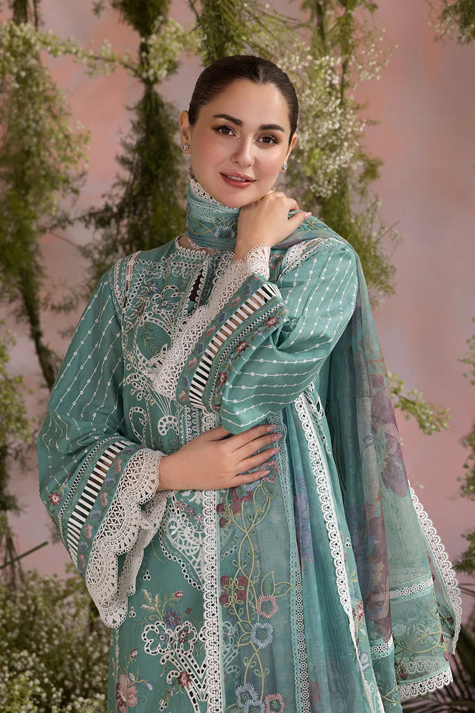 Model wearing Sobia Nazir Design 5B mint green luxury lawn dress with delicate embroidery. Shop Pakistani clothes online in the UK for casual and festive wear.
