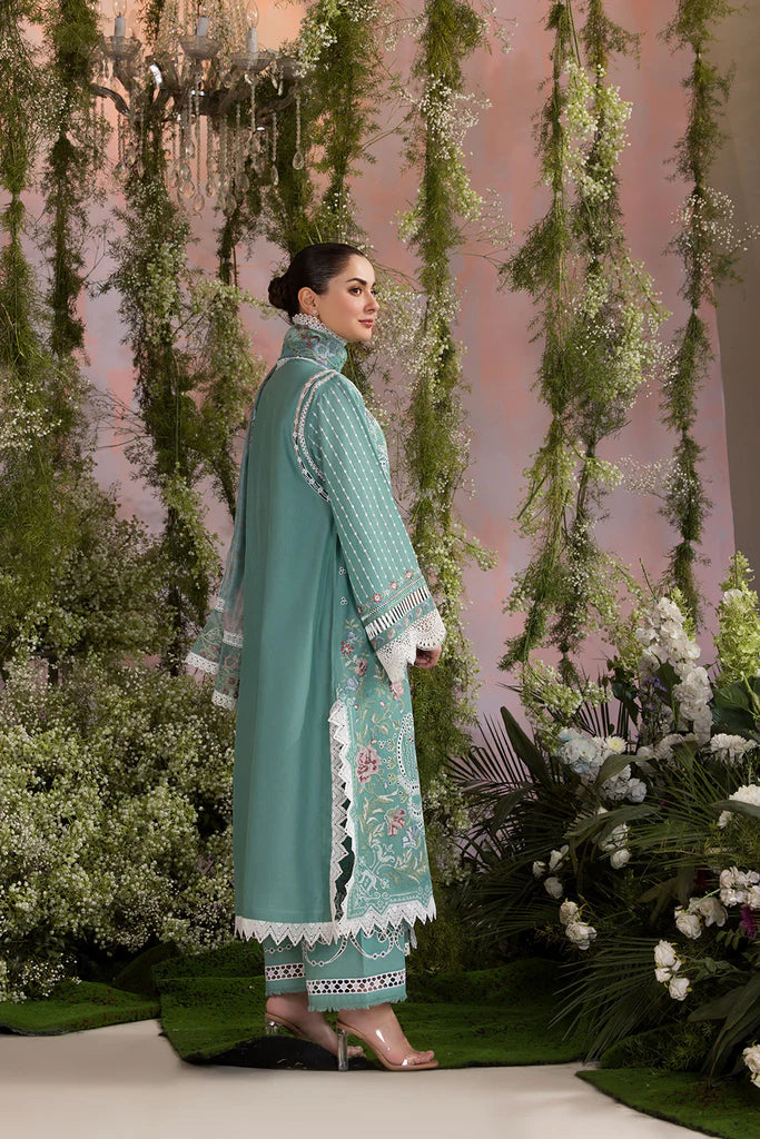 Model wearing Sobia Nazir Design 5B mint green luxury lawn dress with delicate embroidery. Shop Pakistani clothes online in the UK for casual and festive wear.
