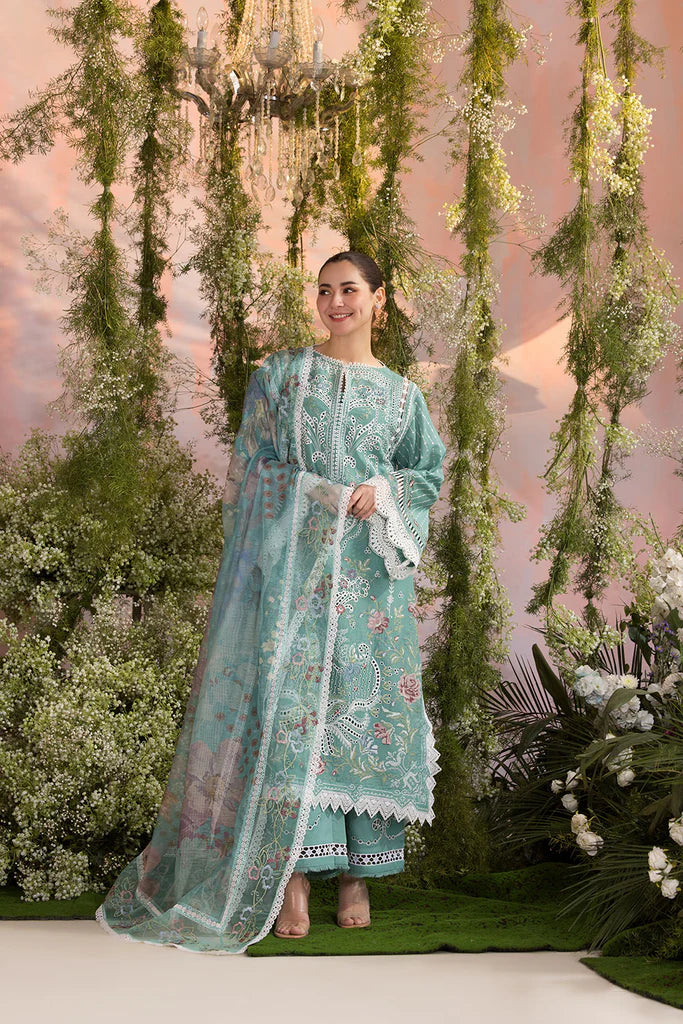 Model wearing Sobia Nazir Design 5B mint green luxury lawn dress with delicate embroidery. Shop Pakistani clothes online in the UK for casual and festive wear.
