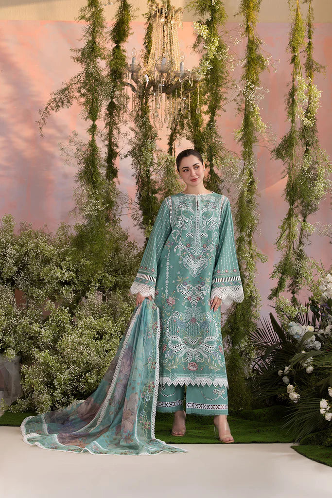 Model wearing Sobia Nazir Design 5B mint green luxury lawn dress with delicate embroidery. Shop Pakistani clothes online in the UK for casual and festive wear.
