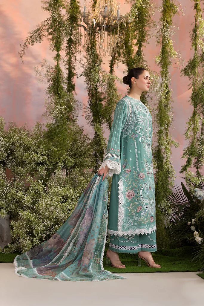 Model wearing Sobia Nazir Design 5B mint green luxury lawn dress with delicate embroidery. Shop Pakistani clothes online in the UK for casual and festive wear.
