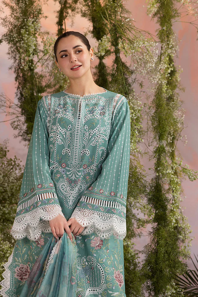 Model wearing Sobia Nazir Design 5B mint green luxury lawn dress with delicate embroidery. Shop Pakistani clothes online in the UK for casual and festive wear.
