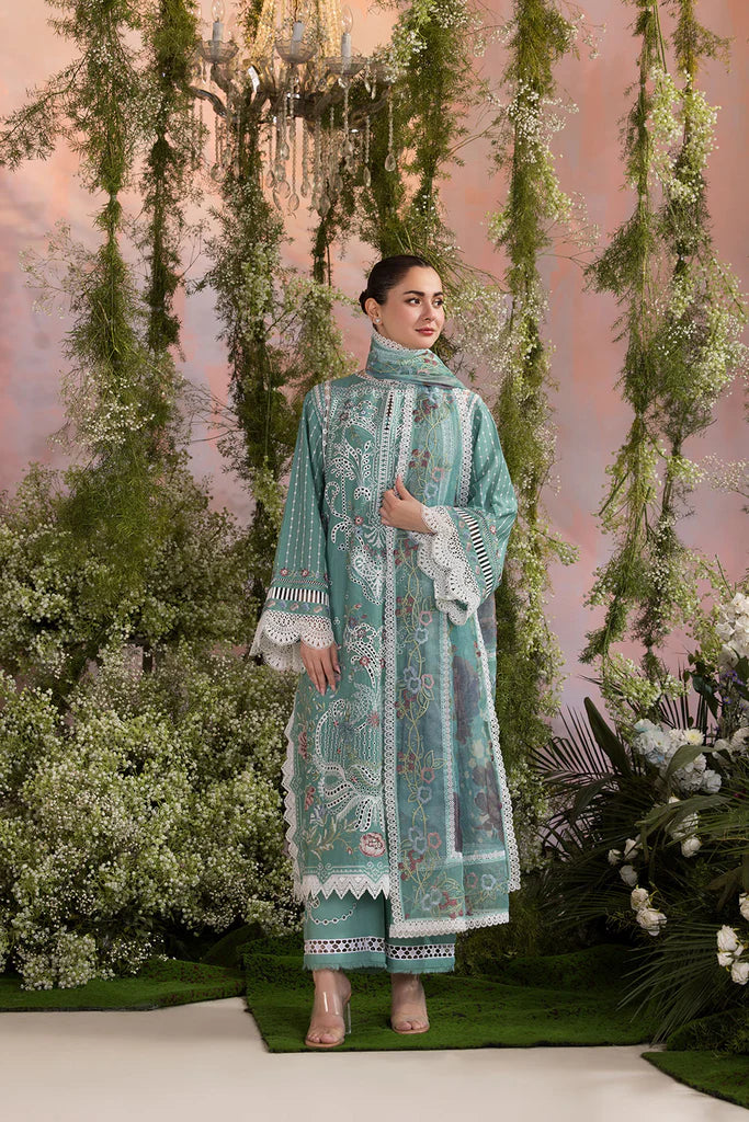 Model wearing Sobia Nazir Design 5B mint green luxury lawn dress with delicate embroidery. Shop Pakistani clothes online in the UK for casual and festive wear.
