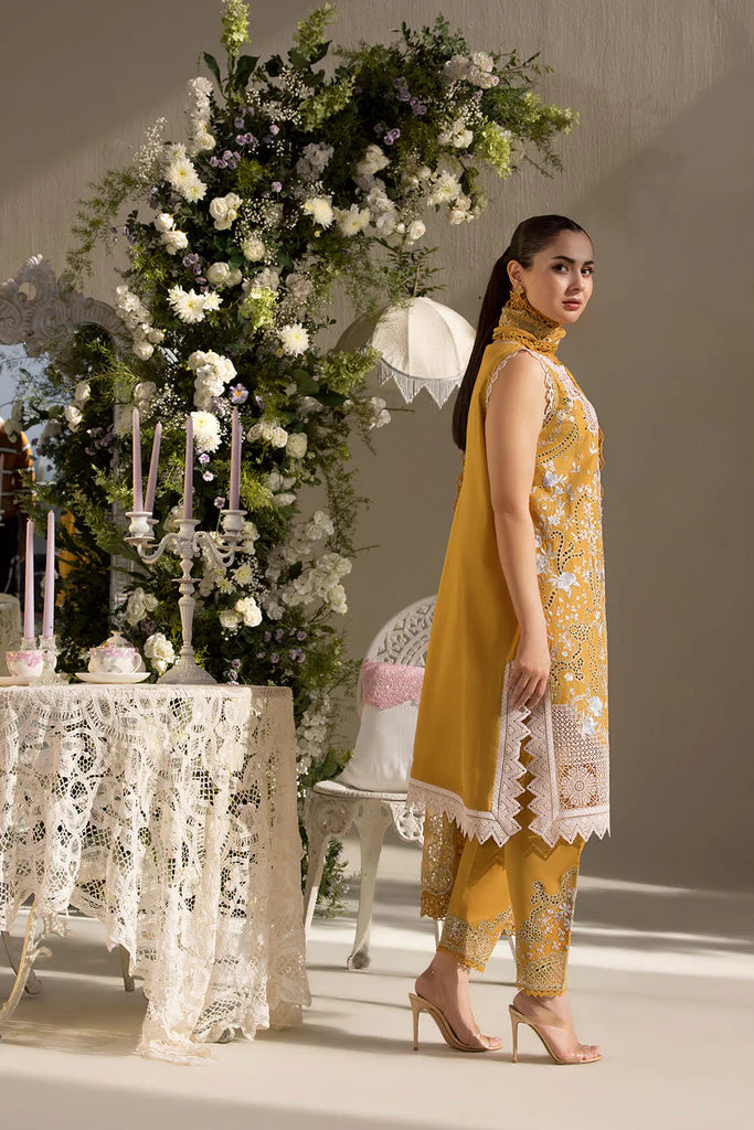 Model wearing Sobia Nazir Design 6B mustard yellow luxury lawn dress with intricate embroidery. Shop Pakistani clothes online in the UK for casual and festive wear.
